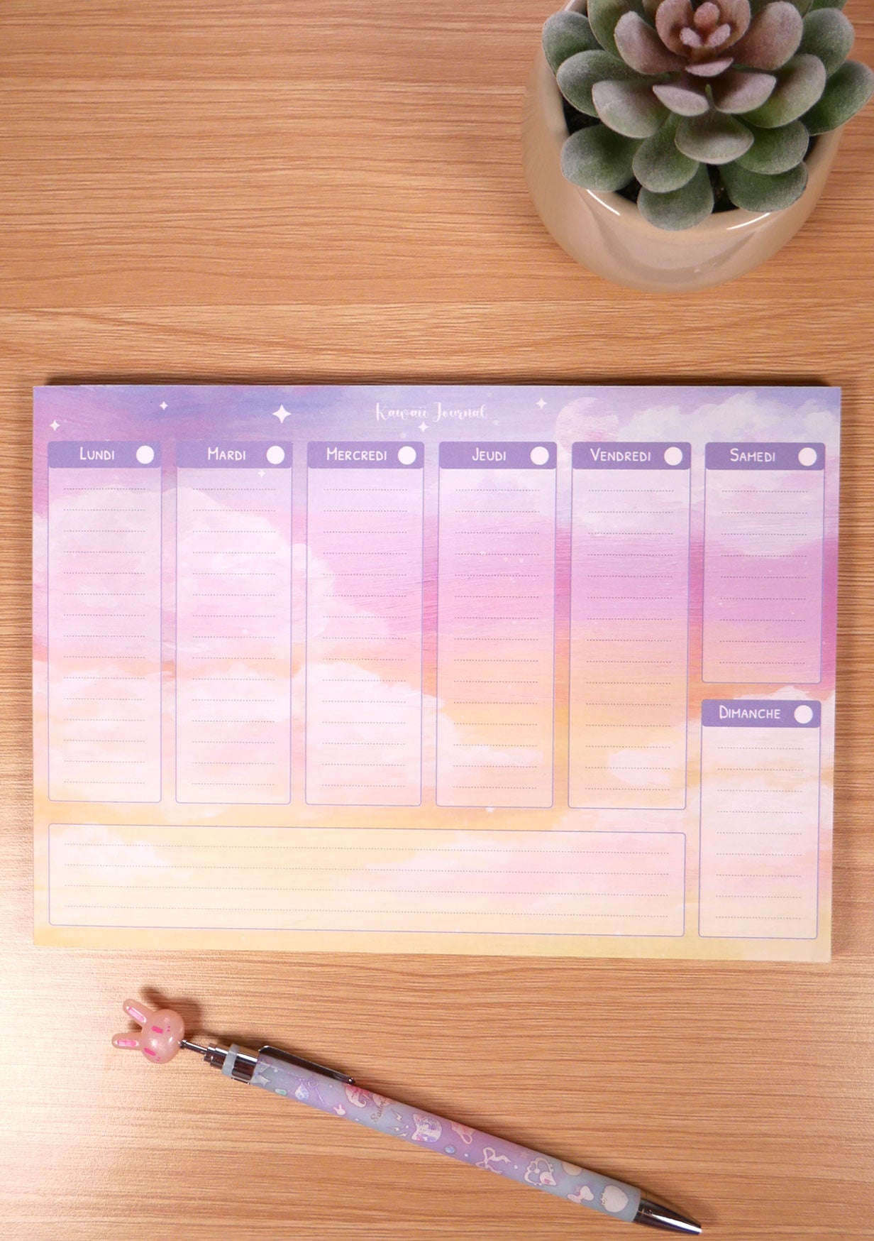 Semainier Yuubae weekly planner agenda hebdomadaire sur un bureau ciel soleil couchant